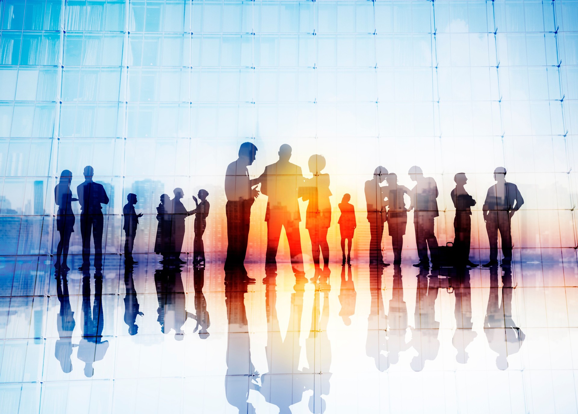 Silhouettes of Business People Discussing Outdoors